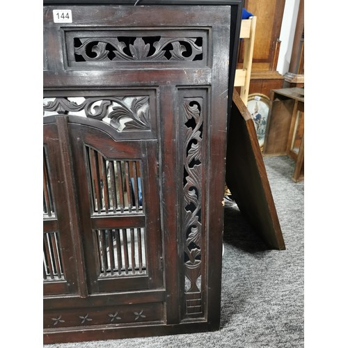 144 - Large impressive rosewood Indonesian shuttered mirror with carving to the edges, doors open to revea... 