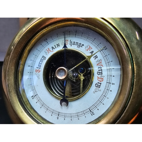 321 - A good antique quality brass free standing travel barometer, in very good looked after condition and... 