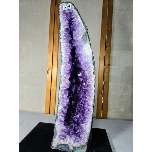 314 - A very large and impressive amethyst cathedral church geode in A grade quality standing at an impres... 