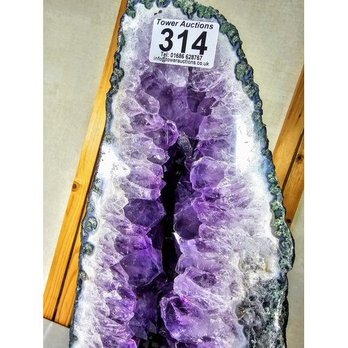 314 - A very large and impressive amethyst cathedral church geode in A grade quality standing at an impres... 