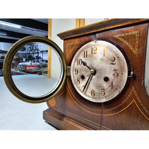 315 - An attractive mahogany vintage mantel clock featuring an unusual dome wooden top and inlay decoratio... 