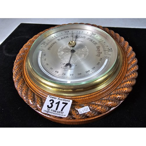 317 - A good quality attractive vintage barometer by J.Hicks London 8021, featuring an ornate carved solid... 