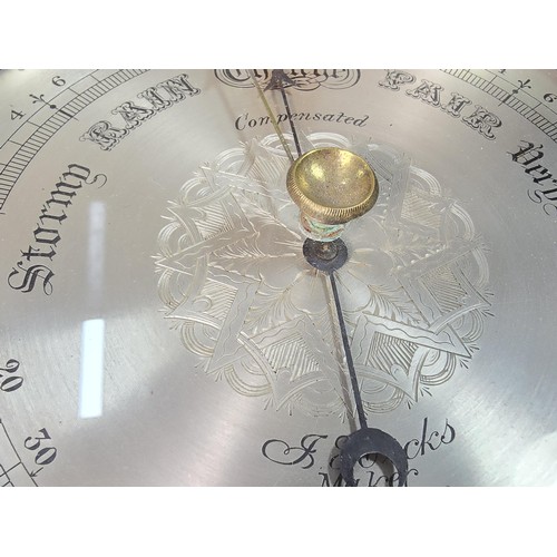 317 - A good quality attractive vintage barometer by J.Hicks London 8021, featuring an ornate carved solid... 