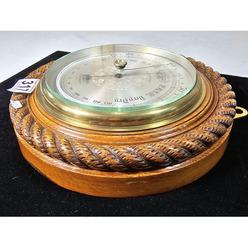 317 - A good quality attractive vintage barometer by J.Hicks London 8021, featuring an ornate carved solid... 