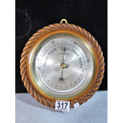 317 - A good quality attractive vintage barometer by J.Hicks London 8021, featuring an ornate carved solid... 