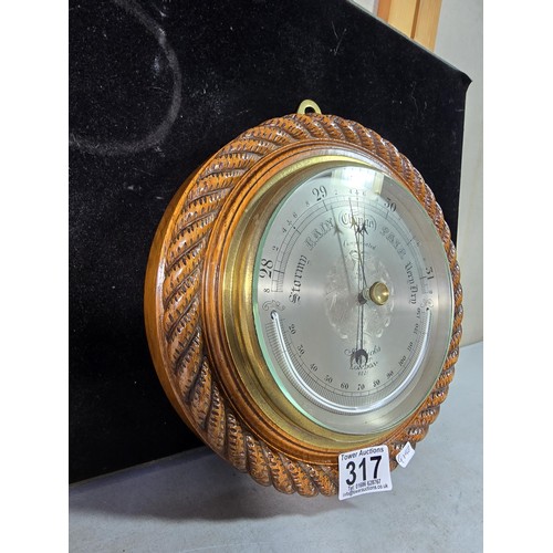 317 - A good quality attractive vintage barometer by J.Hicks London 8021, featuring an ornate carved solid... 