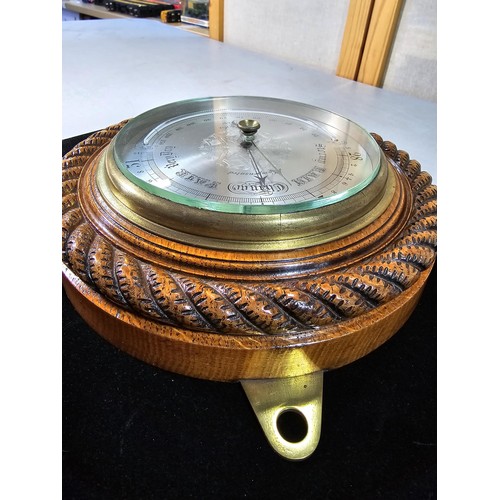 317 - A good quality attractive vintage barometer by J.Hicks London 8021, featuring an ornate carved solid... 