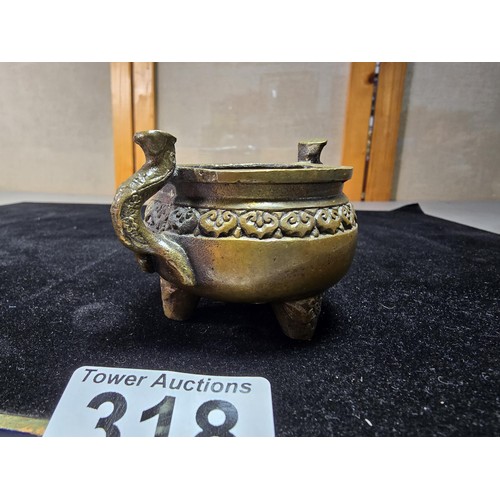 318 - An antique Chinese bronze incense burner having an ornate design with 2 handles either side and a fl... 