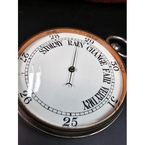 322 - A good quality antique pocket barometer complete with its original leather fitted travel case with a... 