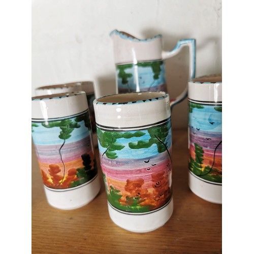 159 - A hand painted ceramic lemonade set with a forest scene to the sides along with 2x studio pottery pi... 