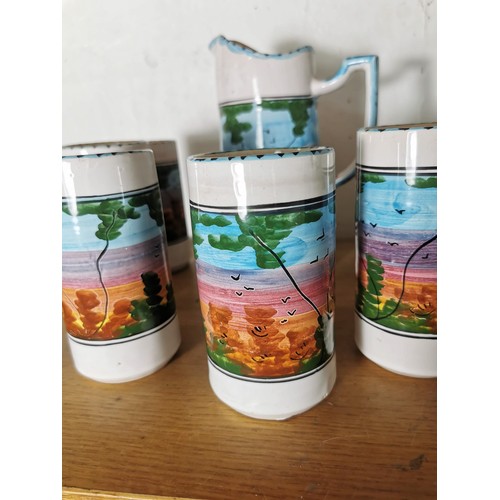 159 - A hand painted ceramic lemonade set with a forest scene to the sides along with 2x studio pottery pi... 