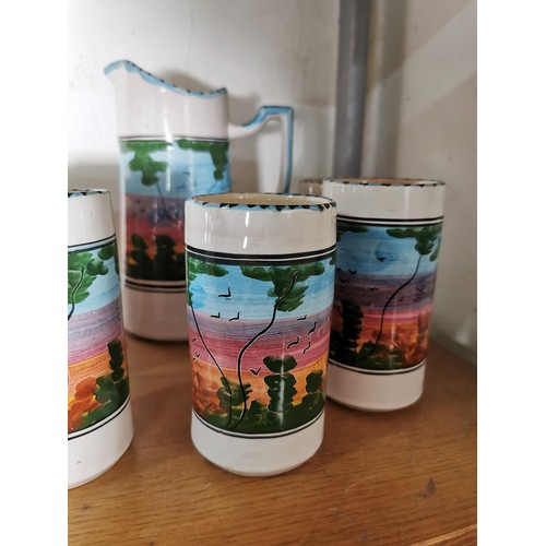 159 - A hand painted ceramic lemonade set with a forest scene to the sides along with 2x studio pottery pi... 