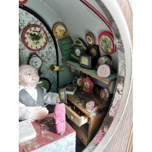 161 - Mantel clock case containing a very well detailed diorama of a man in a clock workshop, surrounded b... 