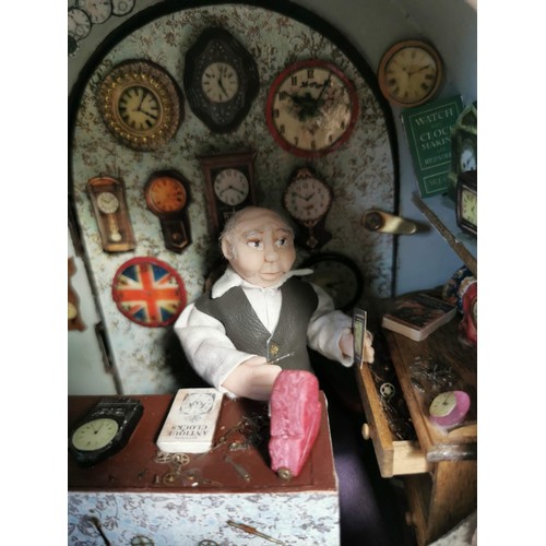 161 - Mantel clock case containing a very well detailed diorama of a man in a clock workshop, surrounded b... 