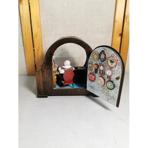 161 - Mantel clock case containing a very well detailed diorama of a man in a clock workshop, surrounded b... 