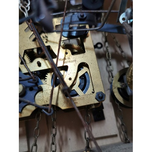 150 - Large Swiss Black Forest Cuckoo clock with carved decoration to the front depicting a Hare and Woodp... 