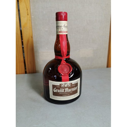 168 - New and sealed bottle of Grand Marnier 70cl along with a chrome hip flask with Celtic knot design, a... 