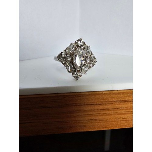 231 - A new and unused stunning 925 silver cluster ring featuring a large quantity of sparkly crystal cz s... 