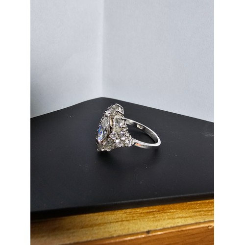 231 - A new and unused stunning 925 silver cluster ring featuring a large quantity of sparkly crystal cz s... 