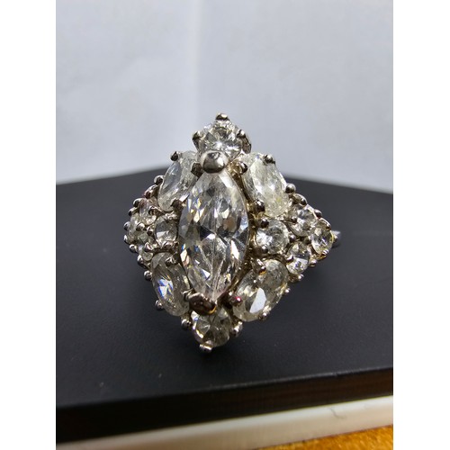 231 - A new and unused stunning 925 silver cluster ring featuring a large quantity of sparkly crystal cz s... 