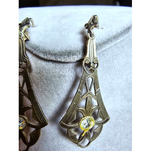 232 - A pair of pretty vintage 980 silver long drop clip on earnings for pierced ears. The earrings have a... 