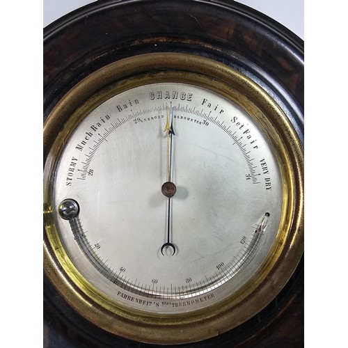 324 - A good early antique aneroid barometer featuring a good turned solid wood case presenting an excelle... 