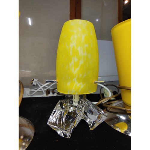 336 - A pair of striking art deco style lamps with conical shaped yellow glass shades along with a similar... 