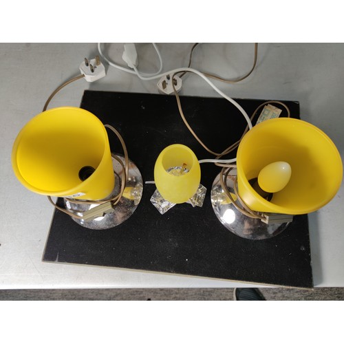 336 - A pair of striking art deco style lamps with conical shaped yellow glass shades along with a similar... 