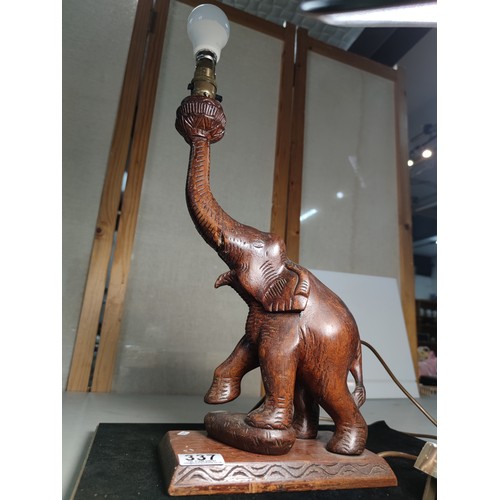 337 - An attractive solid carved wood elephant figure lamp, displays very nicely, may have had an old repa... 