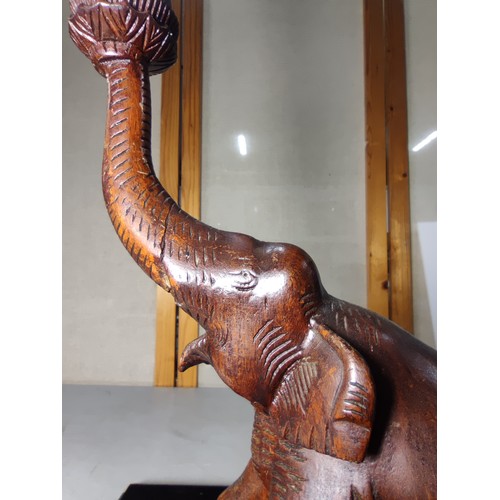 337 - An attractive solid carved wood elephant figure lamp, displays very nicely, may have had an old repa... 