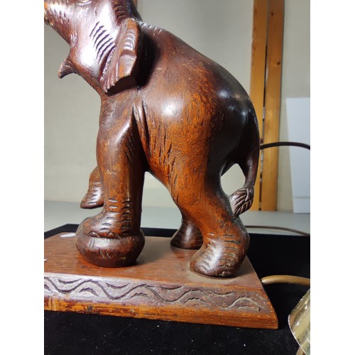 337 - An attractive solid carved wood elephant figure lamp, displays very nicely, may have had an old repa... 