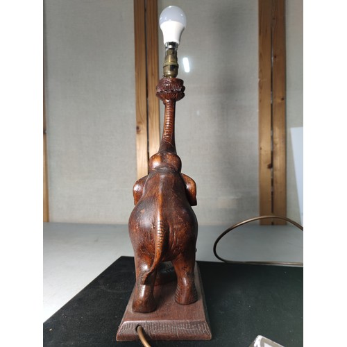 337 - An attractive solid carved wood elephant figure lamp, displays very nicely, may have had an old repa... 