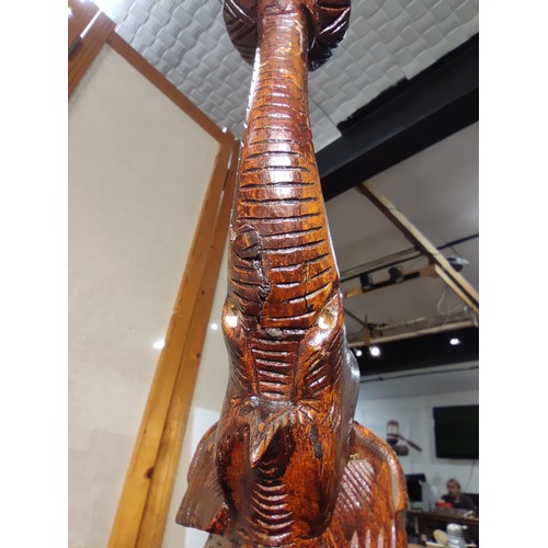 337 - An attractive solid carved wood elephant figure lamp, displays very nicely, may have had an old repa... 