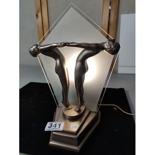 341 - Striking Art deco style table lamp featuring a man and woman figures holding hands to front with a g... 