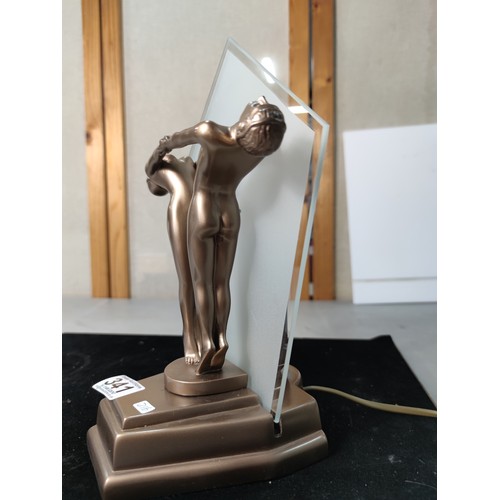 341 - Striking Art deco style table lamp featuring a man and woman figures holding hands to front with a g... 