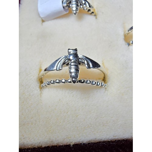 239 - A pretty set of 6x 925 sterling silver as new unused bee formed stacker rings featuring 2 rings to e... 