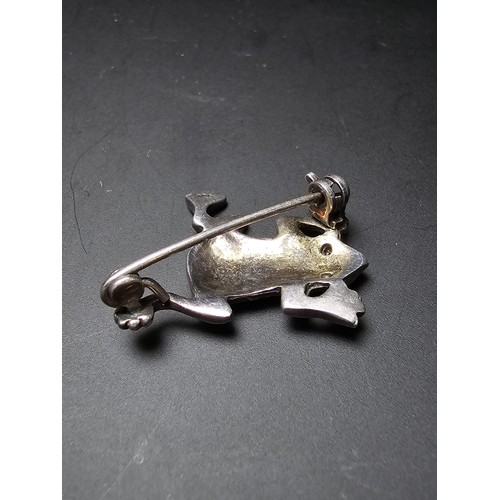 241 - A pretty vintage 925 silver brooch in the form of a frog inset  with marcasite stones having red spi... 