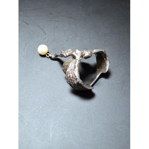 243 - An unusual 925 sterling silver angel formed finger ring having a pearl drop, presenting excellent de... 