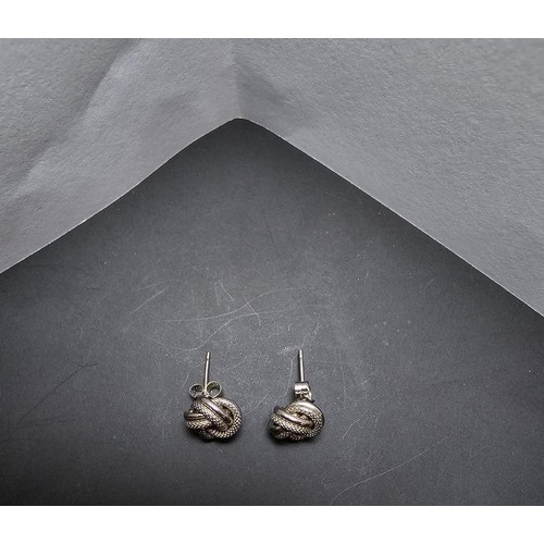 250 - A boxed pair of hallmarked 9ct white gold knot formed stud earrings along with a boxed 925 silver ri... 