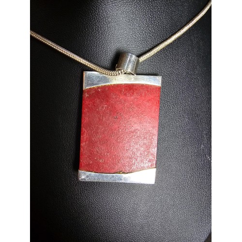 254 - A large 925 silver pendant featuring a red panel set on a good chunky  16