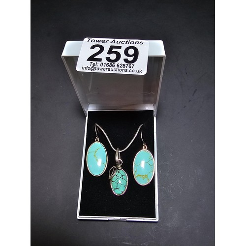 259 - A matching 925 silver jewellery set which includes a 925 silver pendant inset with a turquoise stone... 