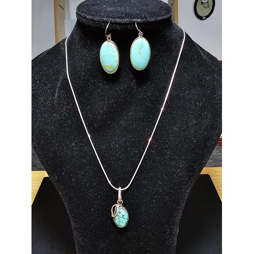 259 - A matching 925 silver jewellery set which includes a 925 silver pendant inset with a turquoise stone... 