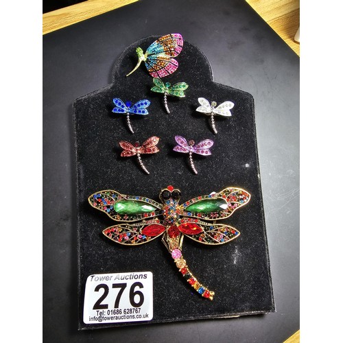 276 - A suite of 7x ornate jewelled dragonfly formed brooches which includes a large ornate multi jewelled... 