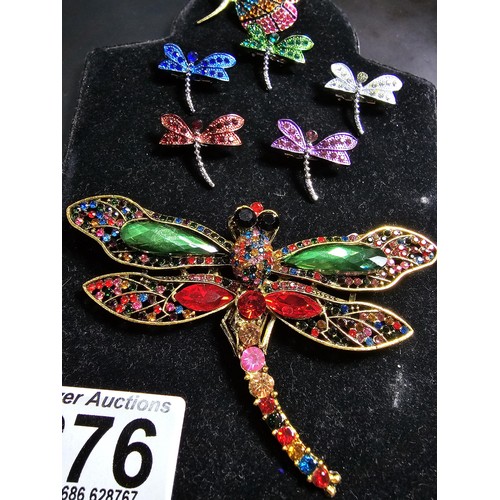 276 - A suite of 7x ornate jewelled dragonfly formed brooches which includes a large ornate multi jewelled... 