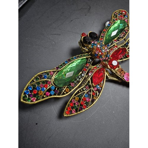 276 - A suite of 7x ornate jewelled dragonfly formed brooches which includes a large ornate multi jewelled... 