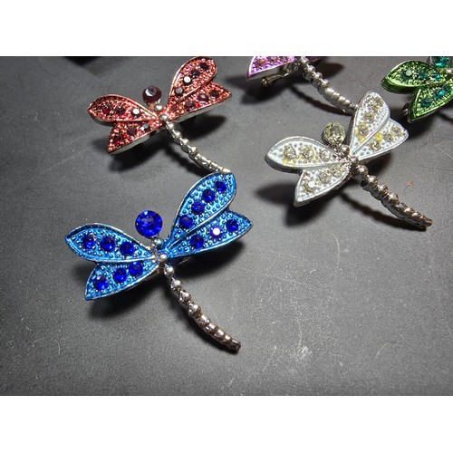 276 - A suite of 7x ornate jewelled dragonfly formed brooches which includes a large ornate multi jewelled... 