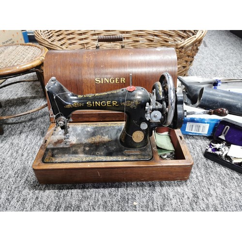 366 - Large dog basket full of various odds along with an antique Singer sewing machine with its original ... 