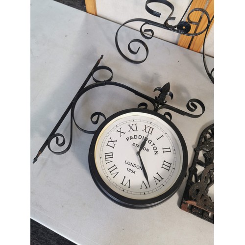 461 - A quantity of ornate metal garden items which includes a Paddington station repro garden wall clock,... 