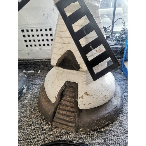 468 - A large and impressive stoneware windmill garden ornament with iron windmill blades which swing with... 