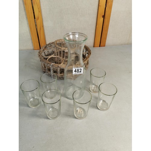 482 - A good quality lemonade set featuring 6 glass tumblers and a carafe all in a fitted wicker basket an... 